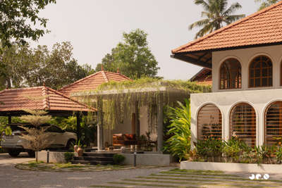 Arcade – Where arches, light, and landscape converse, and tradition finds a quiet 
contemporary soul.
Clients : @aarcha_vinod @ramvinodk 
Area: 4488 Sq.ft
Location: Bharanikavu, Kollam, Kerala.
Principal Architect/Designers: @ar.jun_v_a @_ar_anoop @ananthansurendran 
Interior Styling: Adheena Baburaj @dhii_design_studio 
Photography: @iksha.in #architecturedesigns  #KeralaStyleHouse  #TraditionalHouse  #interiordesignerkerala  #Architectural&Interior   #architectsinkerala