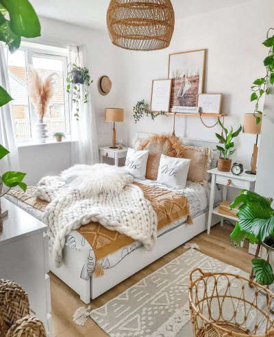 Create a unique, one-of-a-kind boho bedroom look with a bamboo hanging ceiling light, table lamp shade and baskets made of natural material, a woven rug and a lot of greenery with hanging and potted plants. #interior #decor #ideas #home #interiordesign #indian #colourful #decorshopping