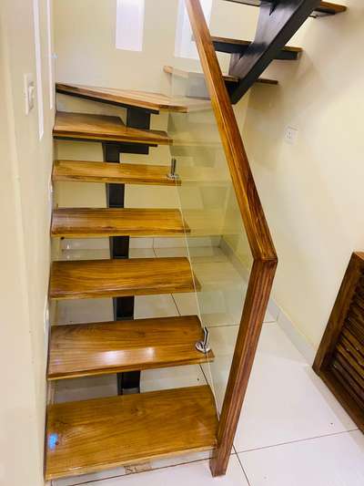 Most popular handrail design now. Wood and Tuff Glass.
