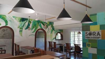 tropical wall  leaves  #restaurantrenovation #interior #sora thekkady