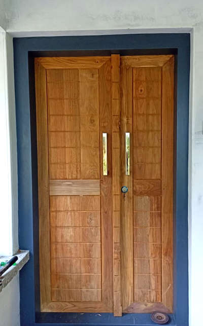 Main door in full clear teak wood #HomeDecor  #homesweethome  #MrHomeKerala  #homedesigne  #KeralaStyleHouse  #keralaarchitectures  #keralahomedesignz  #mybetterhome  #sweet_home  #myhomebuilders