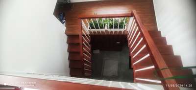 mild steel stair case, mahagani wooden finish. Thrissur.