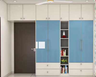 Modern Blue And White 4 Door Swing Wardrobe Design With Open Shelf Unit
Wardrobe Design Details:



Type: Swing wardrobe

Door: 4-door

Wardrobe Dimension (WxDxH): 9x2x10 feet

Style: Modern

Colour:  

- Wardrobe: Frosty white and blue danube

- Loft: Frosty white

Wardrobe shutters: 

- Wardrobe: Laminate in high-gloss finish

- Loft: Laminate in high-gloss finish

Design Benefits: The wardrobe comes with a refreshing dual-toned palette and an open shelf unit to display smaller household items and decor.

Material and finish of the wardrobe can be customised to your liking. 

Carcass Material Options: Medium Density Fiberboard/Plywood/Boiling Water Resistance Plywood/High Density Fiberboard_High Moisture Resistance/Particle board 

Shutter Material Options: Medium Density Fiberboard/High Density Fiberboard_High Moisture Resistance

Shutter Finish Options:Laminate/PU Paint/Anti Scratch Acrylic/Membrane/Pre Laminate/Veneer/Polymer

Size: 12x12 feet
 #WardrobeIdeas  #woodenwardrobedesig