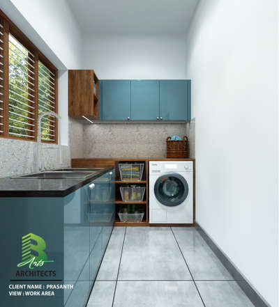 Sleek utility meets smart design — blue cabinets, wooden accents, and a front-load washer tucked neatly into this bright laundry-work corner.

Client : Prasanth
Area : Work Area