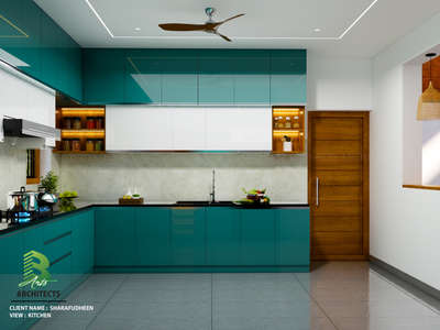 This kitchen perfectly balances bold color with sophisticated design, creating a space that's both functional and breathtaking. 

Client: Sharafudheen 
Area : Kitchen