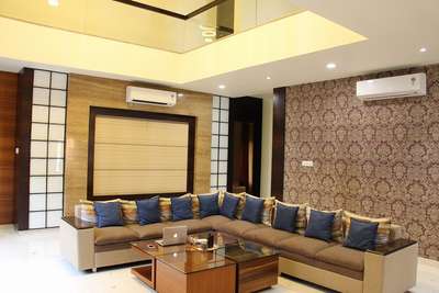 Double height living room with luxury sofa sitting. #interiordesign #interior #interiordesigner #livingroom #livingroomdecor #livingroomideas #livingroominterior #uttrakhand #luxurysofa #interiorshapes #interiorshapesandesigns