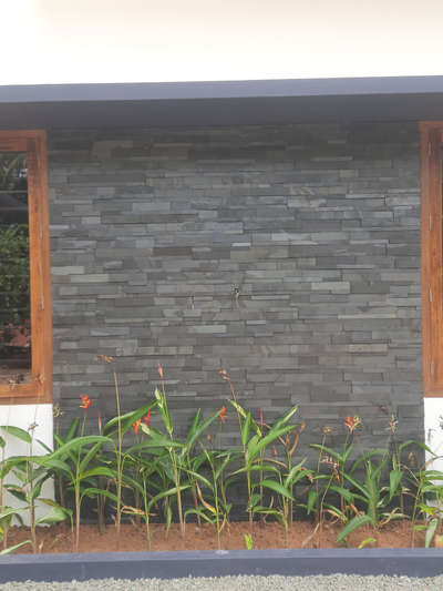 Cladding tiles on show wall & planterboxwith plants , work @ Kulathur , near Infosis, tvm.