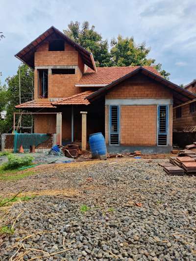 4bhk home under construction at Kulapully

#art #architecture  #kerala #vernaculararchitecture #sustainability #sustainableconstruction #cseb #mudinterlockhouse #mudblock #reuse #reduce #rooftiles