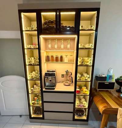 The wooden crockery cabinet is a stylish and functional piece of furniture designed to store and display crockery, dishes, glassware, and other kitchen ... #