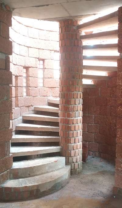spiral stair case with pre cast slab... terracotta #ecofriendly  #costeffectivearchitecture s #StaircaseDesigns