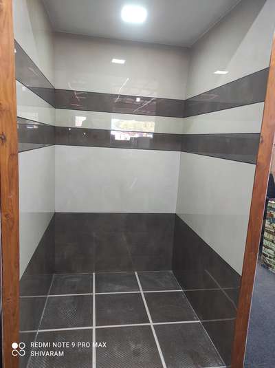 display Bathrooms at Das stone kinfra seethangoli 
sk tile interiours 9746872491