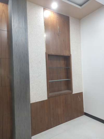*wall Paneling with Charcol and PVD strip*
wall paneling