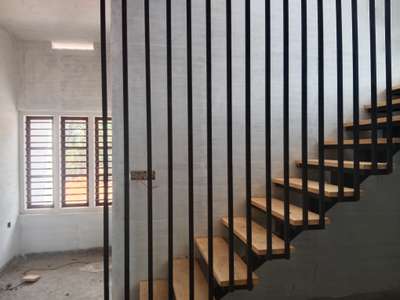 Composite staircase work with Steel, wood and concrete ... landing in concrete slab, stair flights are in steel square pipes, steps in wood... economical when stair room s in minmum size and based on the design which selected