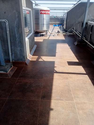 If you also want to make your home beautiful then contact me.
2×2 tiles laying on terrace with 3 mm spacer grove 
 #FlooringTiles #flooring_tiles #tilesflooring #tiles #terracetiles  #rooftiles