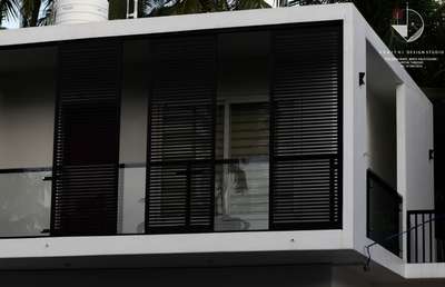 #ContemporaryHouse  #Minimalistic  #louvers  #GlassBalconyRailing