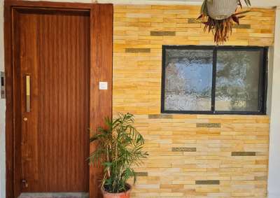 East facing main entrance for a Penthouse
 #door #architecture_lovers #louvers #louverpanel #wooden_panelling #WALL_PANELLING #qmetals #SandStone