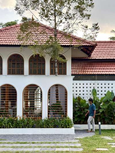 Project 'Arcade'
Arcade combines the elegance of arches with the boldness of traditional design.
Area: 4150 sq.ft.
Location: Bharanikavu, Kollam
Completed :March 2025
Budget: 1.2 Cr

#KeralaStyleHouse  #tropicalhouse #moderndesign #architecturedesigns #keralaarchitectures #TraditionalHouse