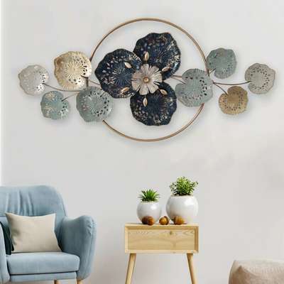 Title: Tetratel Glaive

Come closer to the beauty of pond life with this gorgeous metal wall art. It has a perfect blend of cool and soft hues. The wall art contains a flowery depiction in the center with large blue and golden leaves by the sides.

Dimensions: 47*23 Inches