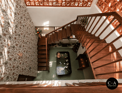 “A home where light, air & design meet beautifully ✨”

Mr. Anuraj Residence | Cherthala
A thoughtfully designed residence blending modern functionality with warm, earthy aesthetics. The space highlights natural light, ventilation, and material harmony, creating a calm and inviting living experience.
The double-height area with jaali wall design enhances airflow and diffused daylight, while the wooden staircase and textures add richness and warmth to the interiors. Carefully curated elements and greenery bring a subtle connection to nature.
Designed & Executed by C+A Design Studio
📍 Location: Cherthala
📐 Project Type: Residential Interior & Architecture
✨ Style: Modern with Traditional Touch
 
#C+ADesignStudio
#KeralaHomes
#KeralaArchitecture
#CherthalaHomes
#DreamHomeKerala
#ModernKeralaHome
#HomeDesignIndia
#InteriorDesignKerala
#HouseDesignInspiration
#IndianHomes
#LuxuryHomesKerala
#MinimalDesignIndia
#ContemporaryKerala
#ArchitectLif