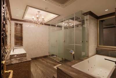 Ethnic look bathroom design with carving mirror glass cubicle and designer ceiling lamps. #ethnic #wooden #FalseCeiling #luxurywashroom  #InteriorDesigner #washroomdesign