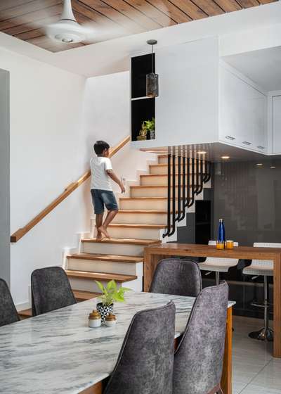 Dining room with open kitchen..
Space under stair use as kitchen cupboard space. #OpenKitchen  #StaircaseDesigns  #DiningTable  #diningroomdecor