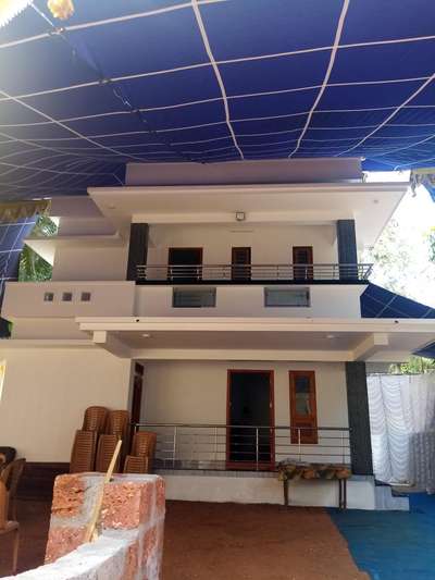1680 sqft house site mass corner Malaparambu client asokan