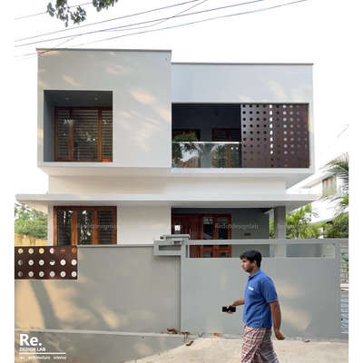 House at pathamkallu in Thiruvananthapuram, Kerala, has been designed by focusing on minimalism. All the amenities and facilities required for a family are arranged in this beautiful house.The exteriors feature the simple yet elegant flat - box style. Designed in 1750 sq ft, this amazing abode has a sit-out, formal and family living areas, dining space, 5 bedrooms and kitchen with a work area.The house stands on 4.5 cents.

Clients: Mr.Ajimkhan and Mrs.Sabeenabeevi
Location: Pathamkallu, Thiruvananthapuram 
Floor area : 1750Sqft
Site area : 4.5 Cent
Completion year : 2025