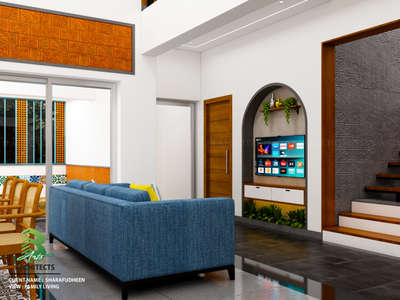 A stylish family living room with a blue sofa and green plants.

Client: Sharafudheen
Area : Family Living Area