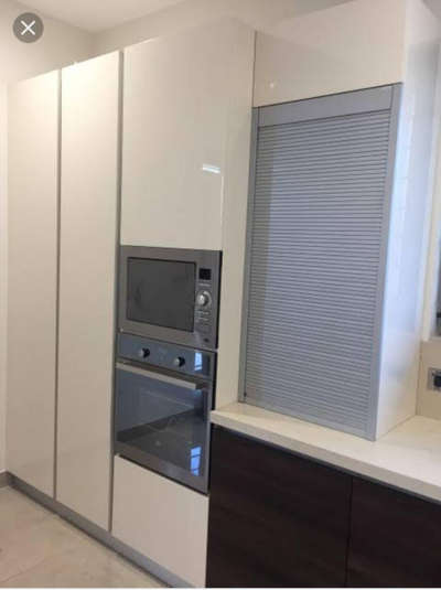 Vertical opening storag space for modern kitchen.