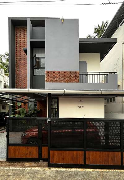 A compact urban residence defined by exposed brick, clean grey volumes, and bold geometric lines. Thoughtful window placements, subtle landscaping, and a refined material palette create a warm yet contemporary architectural presence. A modern home crafted for simple, seamless city living 

#Architecture #ResidenceDesign #ContemporaryHome #BrickFacade #ModernArchitecture #UrbanLiving #ArchitecturalDesign #MinimalDesign #koloprojects