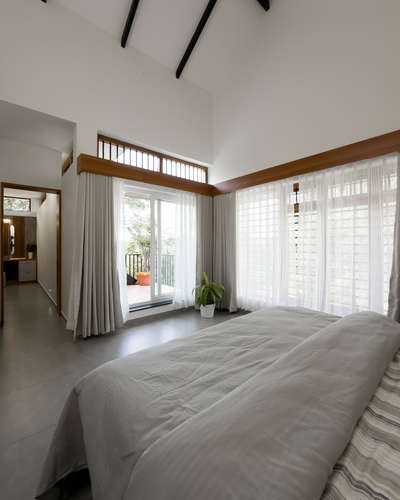 Master bedroom with balcony design by Mithi Architects.

 #MasterBedroom #BalconyIdeas #dressingunit