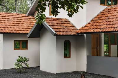 Name : House Allath 
Area: 2000 sqft
Location: Poonthanam, Kerala
Typology: Residential
Photography: @spiritwallstudio

Nested among dense natural cover, 'House Allath' follows the notions of present lifestyle, yet stays rooted in Kerala's rich Vernacular architectural history. Minimalist design approach of Allath resonates in its overall built envelope, colour and material palette.

#livingroomideas #Indiankitchen #Architectural&Interior #architectsinkerala #SlopingRoofHouse  #livingroom #diningtabledecor #diningtable #diningroom #diningroomdecor #bedroomdesign #studyroom #kitchendesign #kitchendecor #kitchen #homecentre #homecentreindia #inbuilt #flooring #asianpaints #instaphotography #instaphoto #photography #photoshoot #tharavadu #instapic #kerala #india #