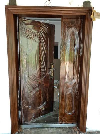 *Steel doors*
wood color steel doors with frame and kattila by cuirass steel doors Calicut