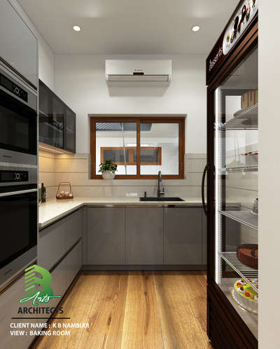 Modern baking haven 🔪🍰 
– sleek grey cabinets, warm wood floors, and a stylish display fridge that makes every dessert feel like a masterpiece.

Client :K R Nambiar
Area : Baking Room