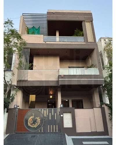 Every line, texture and tone in this home tells a story of warmth, precision and balance.
A play of earthy tones, wooden ceilings, and metal details blend modern aesthetics with timeless elegance.
From the handcrafted gate design to the subtle beige–brown palette and jaali accents — every element was chosen to bring harmony and comfort together.

A home that feels designed, not decorated. ✨
Crafted with love, refined through process, and built to inspire.
- Designed by Studio Spiral 

#Architecture #ArchitecturalDesign #ModernElevation #HomeDesign #FacadeDesign #ArchitectureIndia #JaipurArchitects #ContemporaryHome #LuxuryResidence #DesignWithSoul #ArchitecturalStory #MaterialHarmony #ArchitectureLovers #ModernIndianHomes #DesignProcess #CraftedWithLove #HomeThatInspires #ElevationDesign #ArchitecturalElegance #Interior