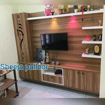 dreamzone interiors 
TV unit /puja :- Plywood with lamination