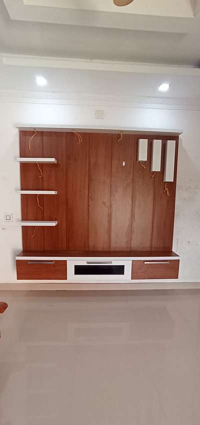 T V Unit
maryan ply and mica 
quality 710 
wood finishing
