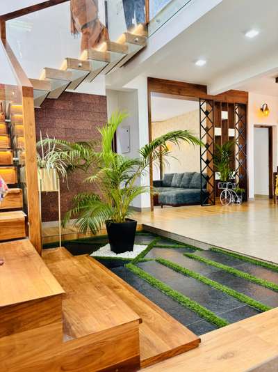 Indoor plants gives a positive feel for home #Indoilants  #indoordesign  #indoorcourtyad  #IndoorPlants  #indoorlights  #homesweethome  #ContemporaryHouse  #modernarchitect  #modernarchitecturedesign  #modularwardrobe  #HouseCcction  #constructioncompany  #semi_contemporary_home_design