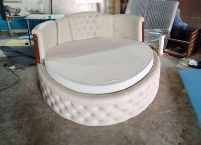 king size round shape bed with bed sheet