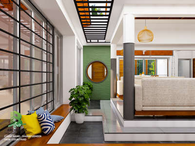 Modern courtyard bliss: green brick accent, sleek swing seat, and an open skylight that lets natural light dance over the stylish lounge vibes.🌿✨🏡

Client: Sharafudheen 
Area : Courtyard