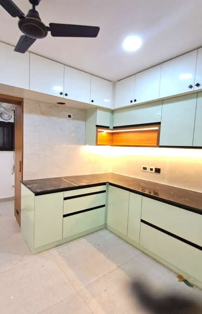 Providing Kitchen Bottom, Top unit & loft made out of 16 mm thick Laminate Marine Ply (IS: 710, BWP Grade- Green Ply/Century) 
shutters/drawers with matching PVC edge band
inside 0.8 mica 
Bottom 16mm box structure 
backside 4mm multi Wood covering, 
1mm high glossy mica shutter's front
Firont Shutter Acrylic finishes
Without Granite work and Hob & Hood