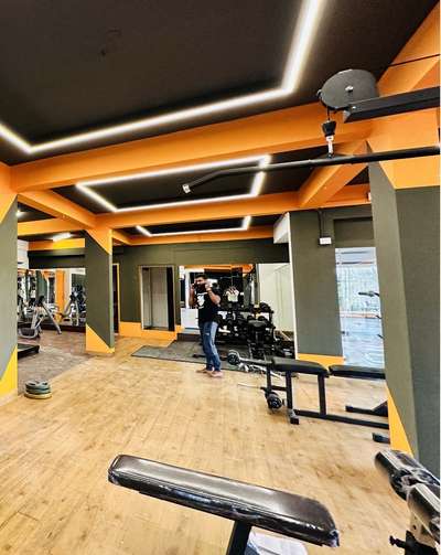 A dynamic gym design with vibrant accents, smart lighting, and an open layout that inspires energy and performance.

#Interior_Work #workout