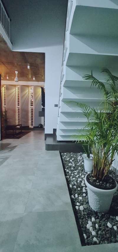 #ContemporaryHouse #KeralaStyleHouse #FlooringTiles #GlassStaircase #SmallHouse