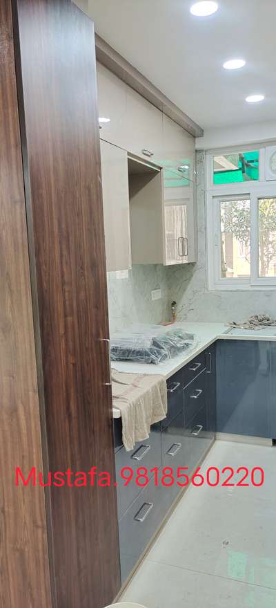 Modler kitchen.somani tiles slab nano white stone