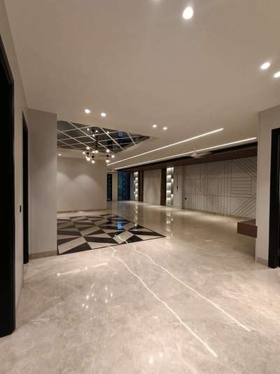 A beautiful combination of flooring and false ceiling with profile lights. #interiordesign #interiors #lights #flooring #flaseceiling #interiors #hall #luxuryinterior #profilelights #lighting #marble #interiorshapes #interiorshapesandesigns