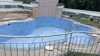 Re tiling of an old pool is completed