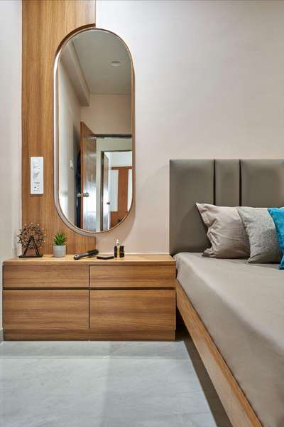 This modern bedroom design by Evolve Interiocrat showcases a sleek and minimalist aesthetic. 🪄💗

The centerpiece is a stylish wooden bedside table with clean lines, featuring ample storage space with its drawers. The overall design employs a neutral color palette with hints of natural wood, creating a warm and inviting atmosphere ideal for relaxation 🌟

#luxuryliving
#interiordesignexcellence
#timelesselegance
#innovativedesign
#dreamhome
#interiorinspiration
#homedecor
#craftsmanship
#designgoals
#interiordecor
#homedesign
#creatingbeautifulspaces
#styleandsubstance
#highendliving
#masterpiece
#creativespaces
#modernluxury
#elegantinteriors