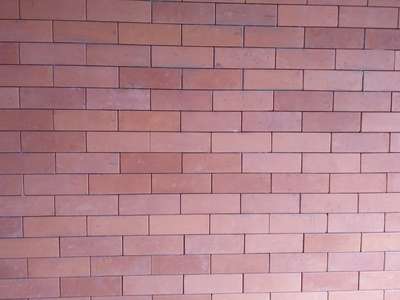 Brick cladding ചെയ്ത ഒരു ചുമർ