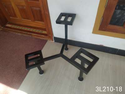 METAL STAND FOR INDOOR PLANTS.
 
Durable, Eco friendly. Rest free, Not harmful for any floor, Adjustable legs for leveling.