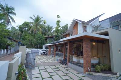 elevation |car porch| courtyard| Kozhikode #HouseDesigns #ElevationHome #Architect #CivilEngineer #ElevationHome #KitchenIdeas #ContemporaryHouse #TraditionalHouse #KeralaStyleHouse #Kozhikode #carporch